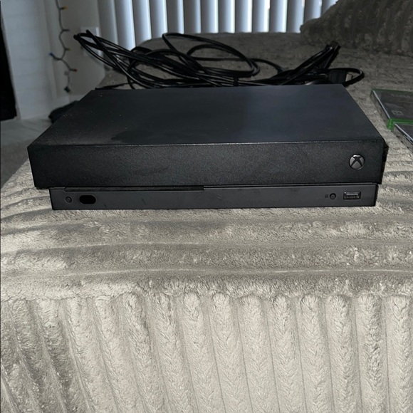 Black Xbox One X Console with Slim Design and Popular Game Selection